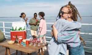 Friends Hugging Birthday Woman at Party