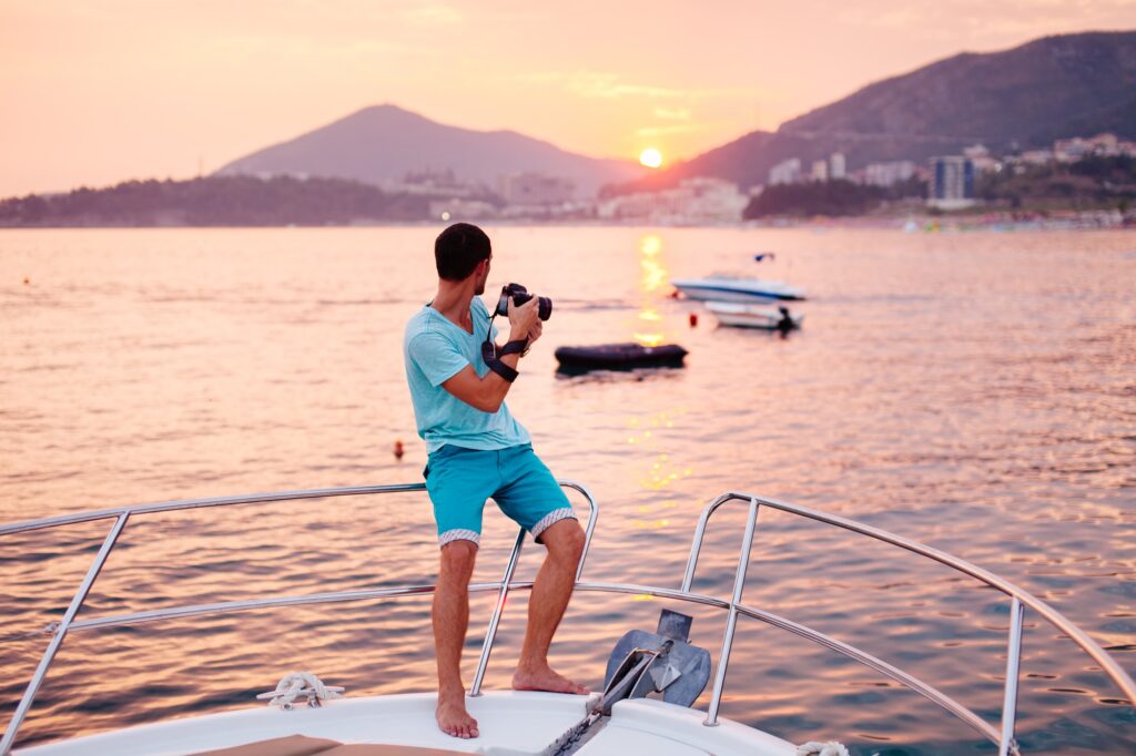 tourist man travel on yacht at sunset