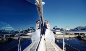 Wedding couple is hugging on a yacht